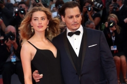 Эмбер Херд обвиняет Джонни Деппа в избиениях